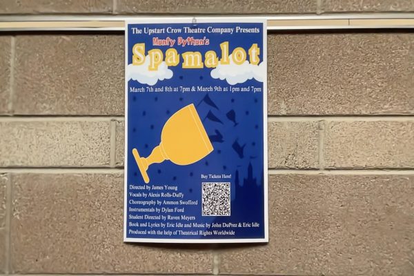 Spamalot posters hang throughout the DRHS halls, displaying show information, times, and a QR code to buy tickets.